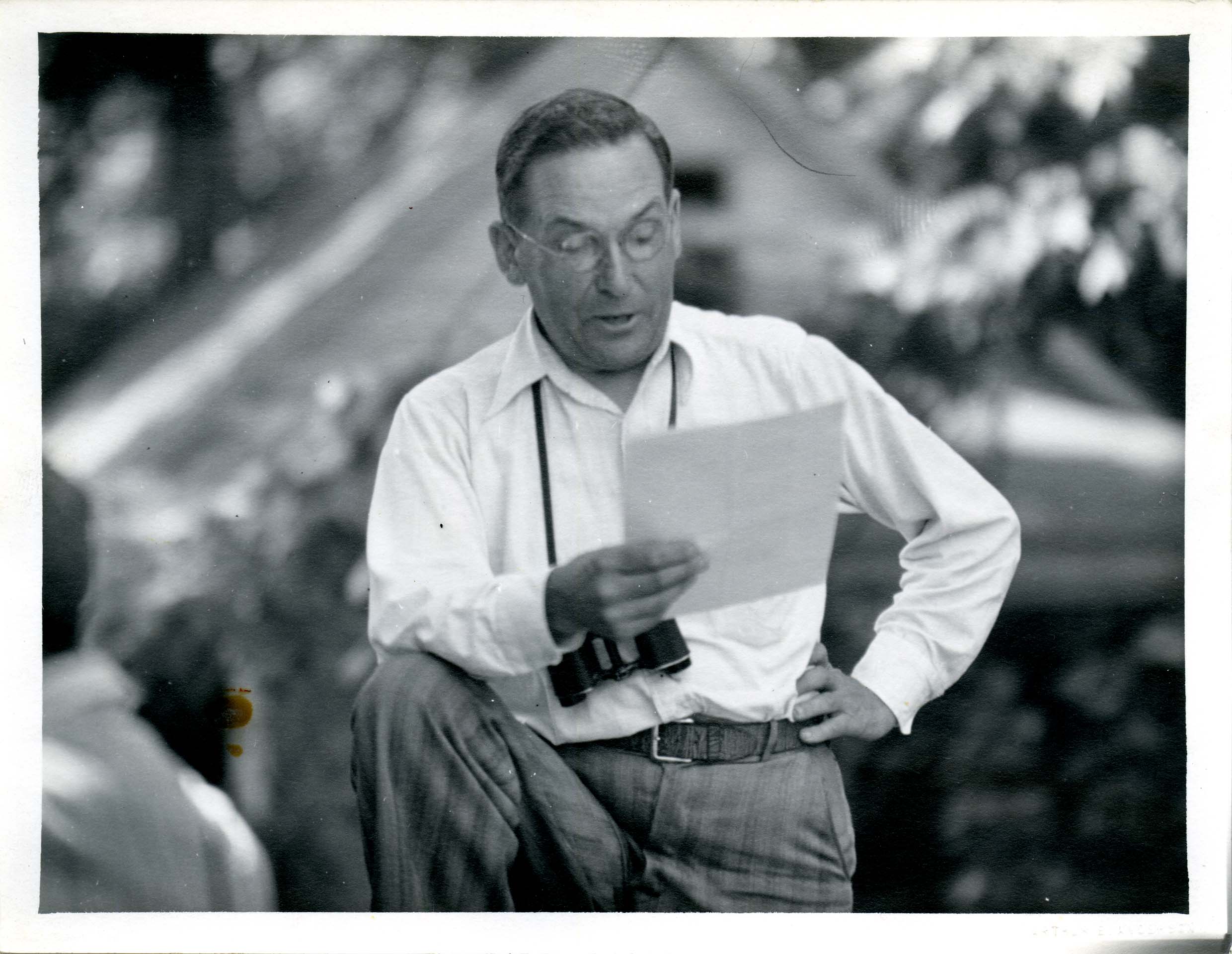 Photograph of Walter Rosene reading poems on a field trip in McGregor Heights