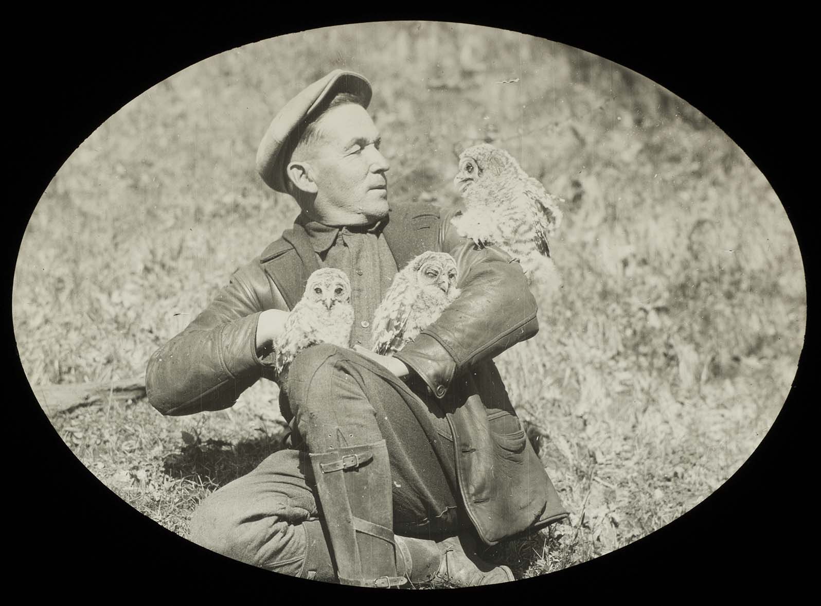 Lantern slide and photograph of Walter Rosene posing with owls